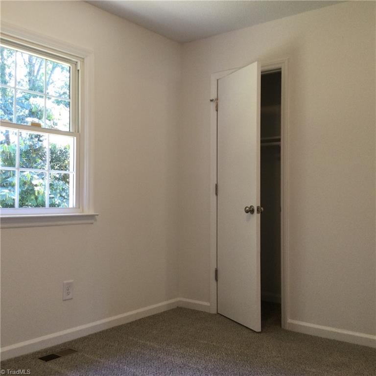 1017 Sales Street High Point, NC 27260 - Photo 30 of 40 Bedroom 3: Fearures include carpet flooring to help keep you warm on cool mornings, fresh new paint and a widnow for natural lighting. The open door is for the closet,