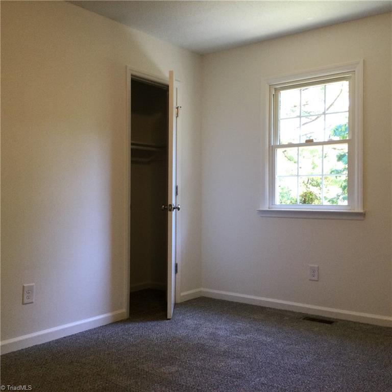 Bedroom 2: Fearures include carpet flooring to help keep you warm on cool mornings, fresh new paint and a window for natural lighting. The open door is for the closet.