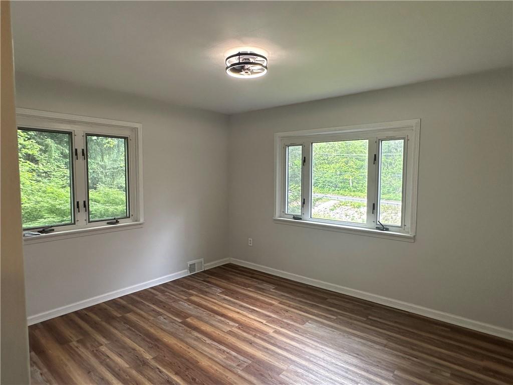 201 Clever Road McKees Rocks, PA 15136 - Photo 18 of 30 a view of empty room with wooden floor and fan