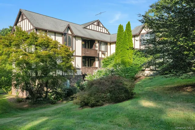 a yellow building with trees in front of it