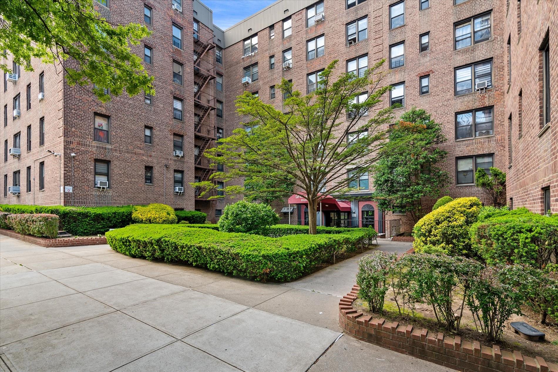 a view of a building with a garden