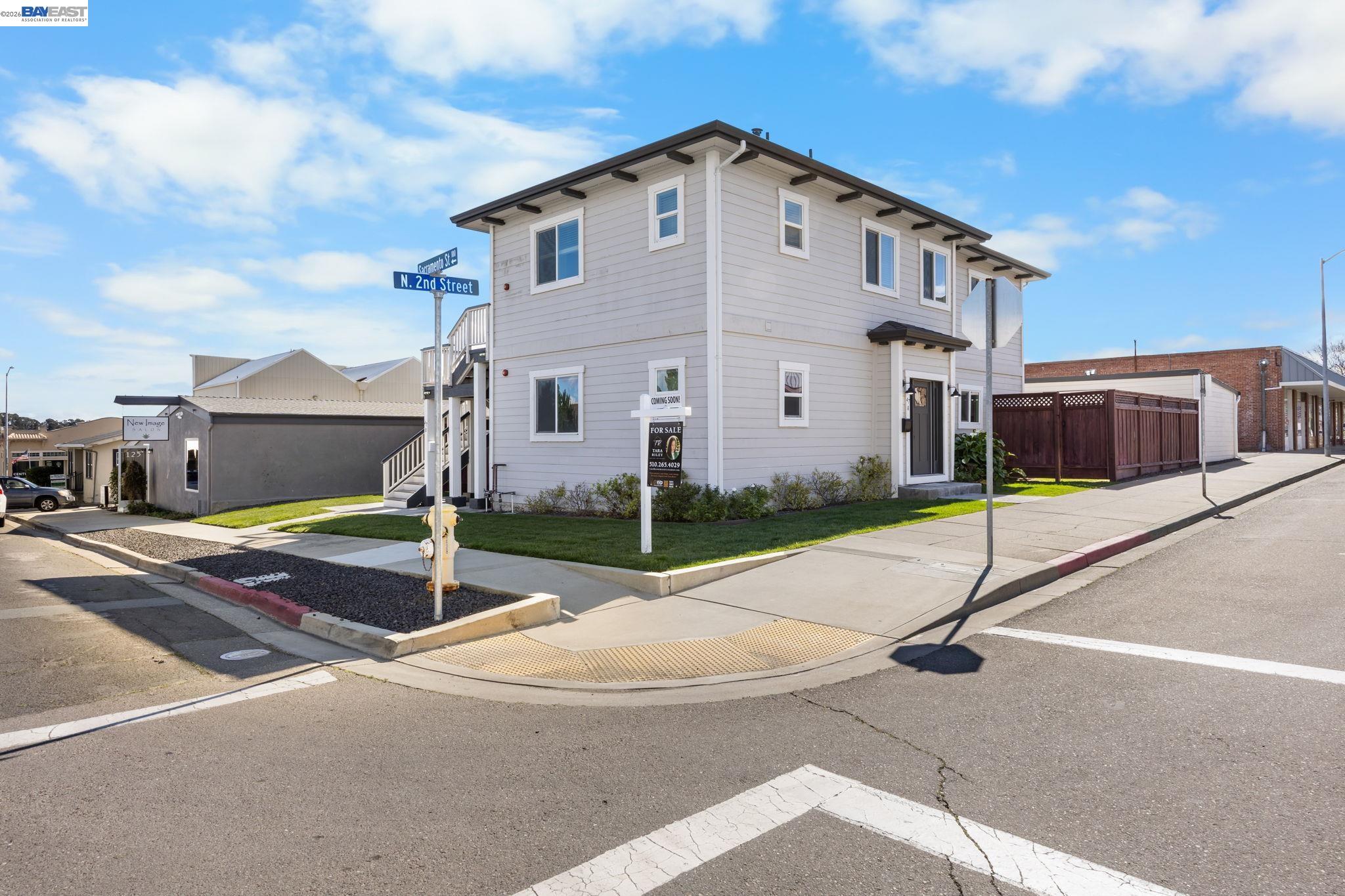 47 North 2nd Street Rio Vista, CA 94571 - Photo 2 of 42 a white house with a yard and car parked