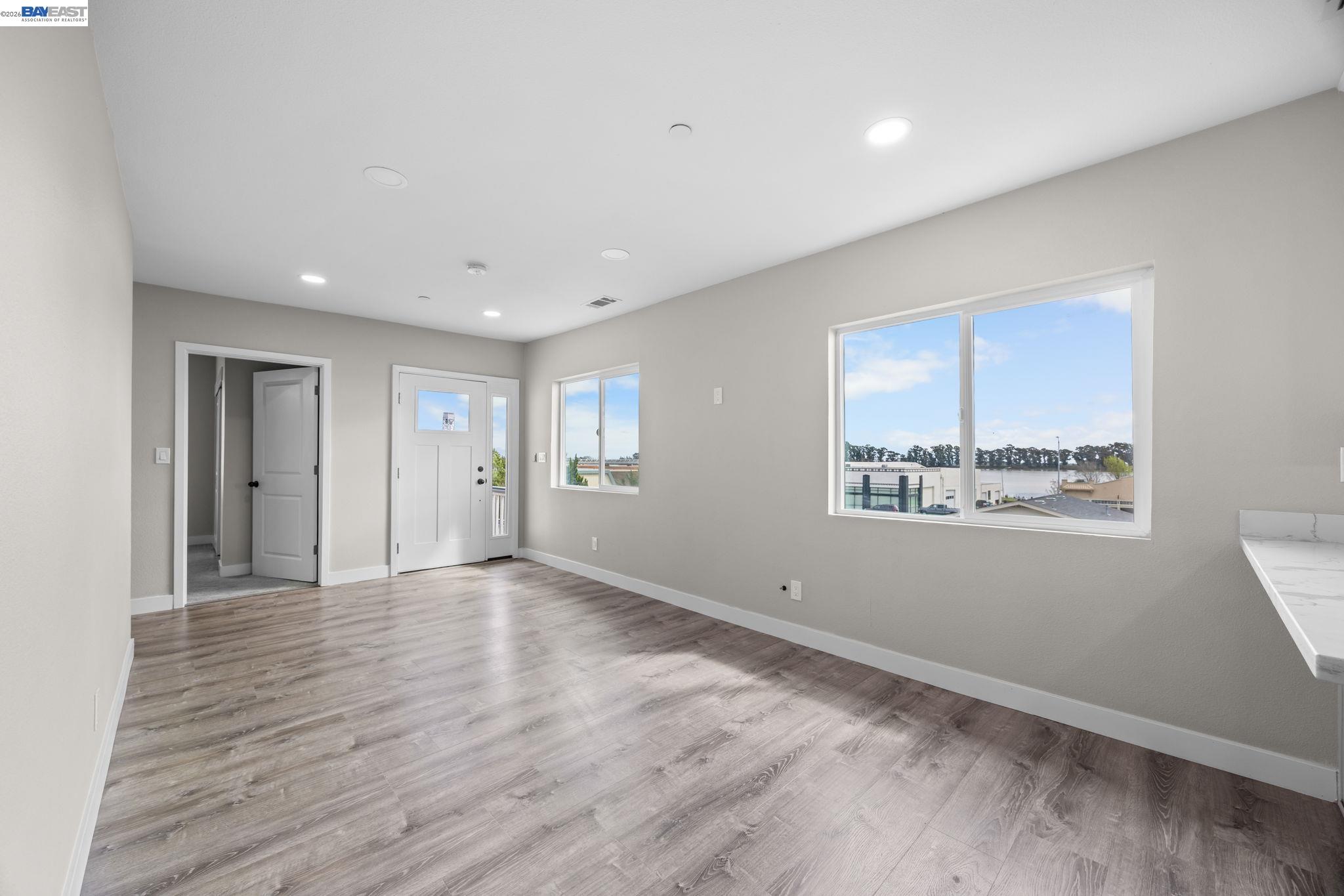47 North 2nd Street Rio Vista, CA 94571 - Photo 21 of 42 a view of an empty room with wooden floor and a window