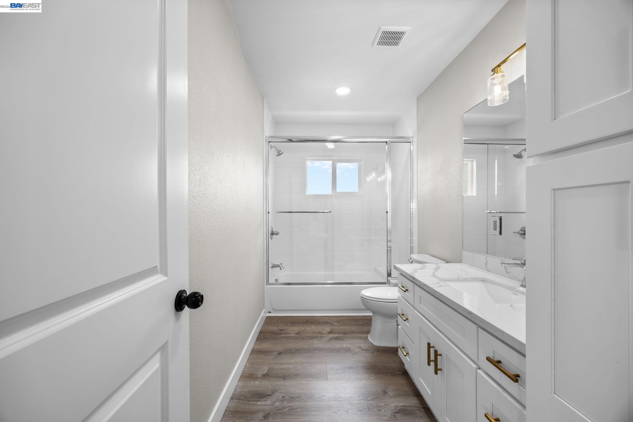 47 North 2nd Street Rio Vista, CA 94571 - Photo 26 of 42 a bathroom with a double vanity sink toilet and shower