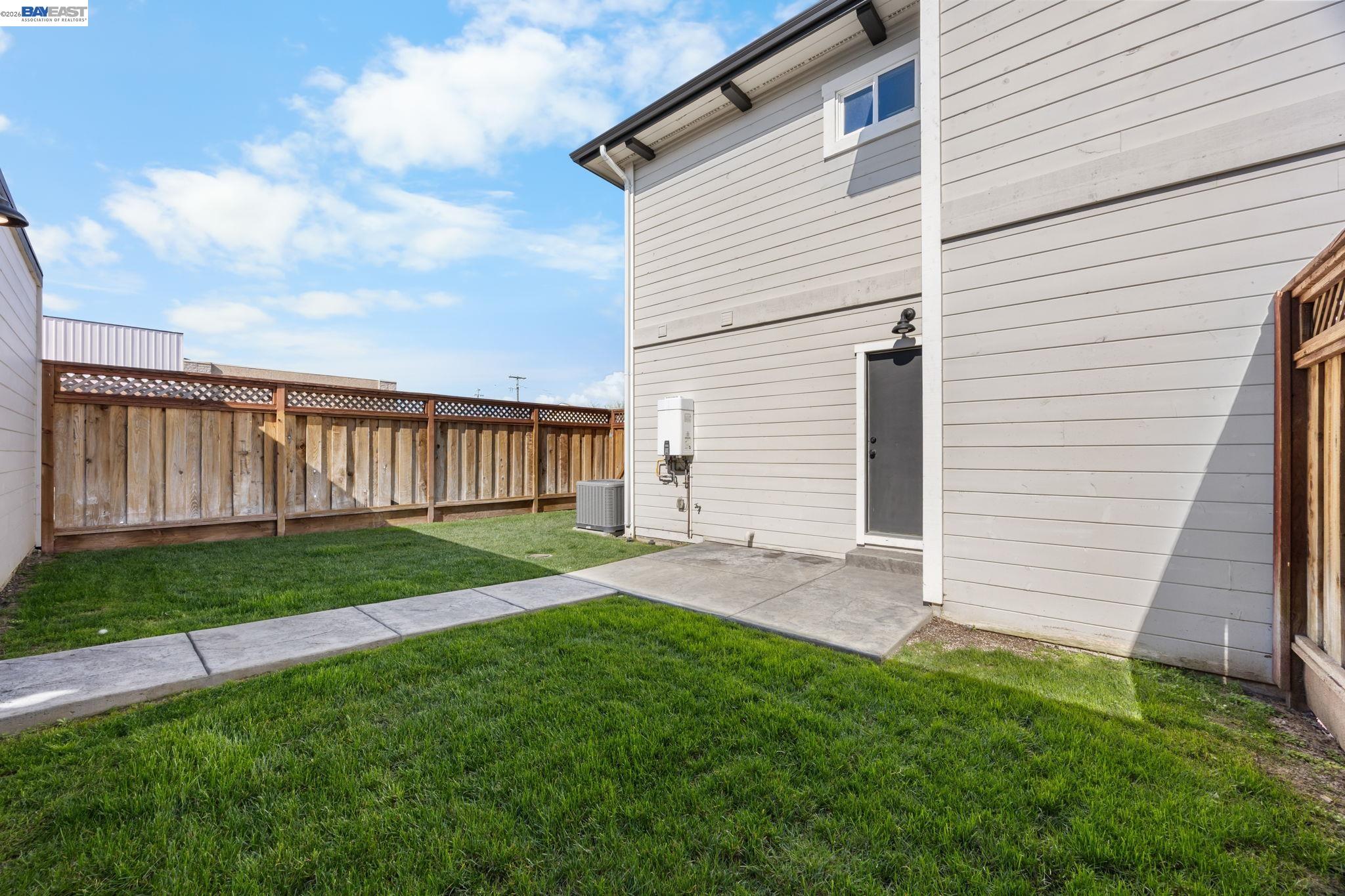47 North 2nd Street Rio Vista, CA 94571 - Photo 8 of 42 a view of a backyard with plants and large trees
