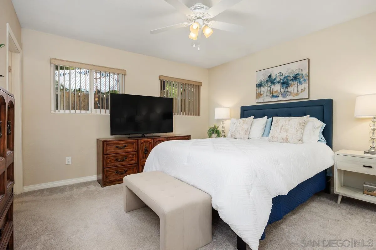13961 Eastern Street Poway, CA 92064 - Photo 12 of 29 a bedroom with a bed and a flat screen tv