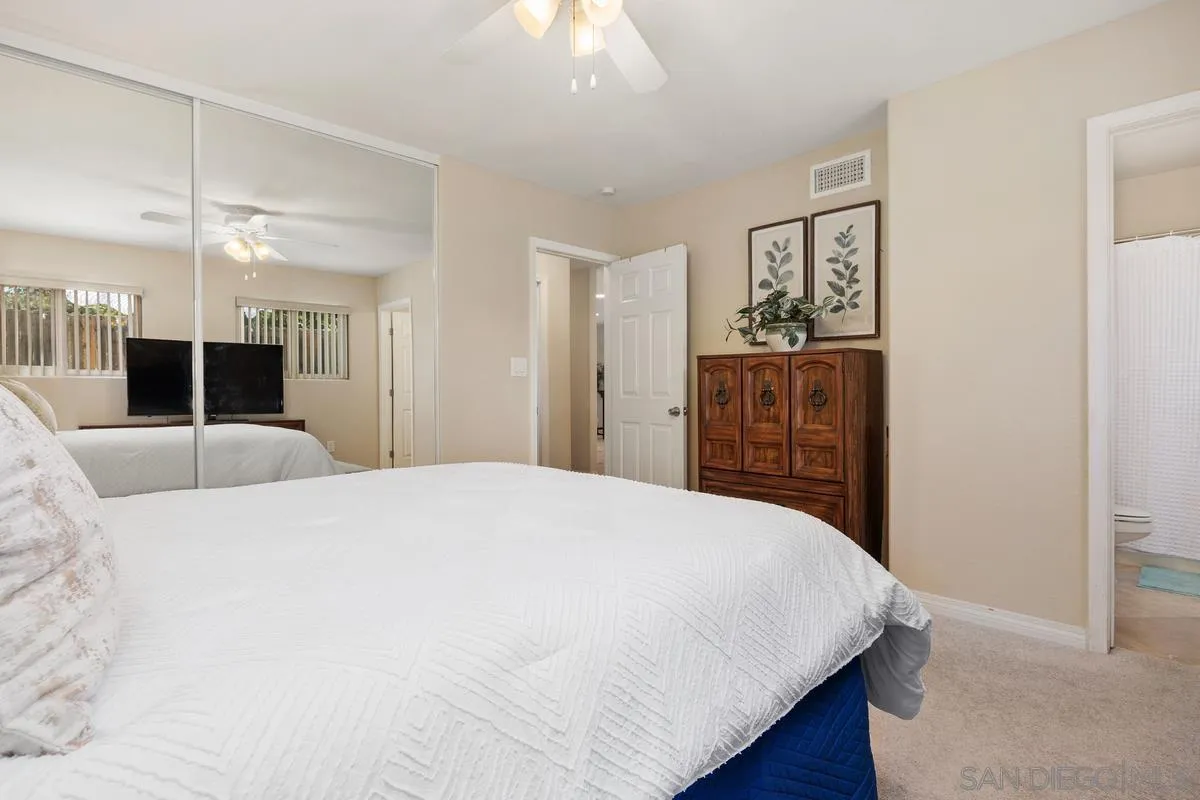13961 Eastern Street Poway, CA 92064 - Photo 13 of 29 a bedroom with a large bed and dresser