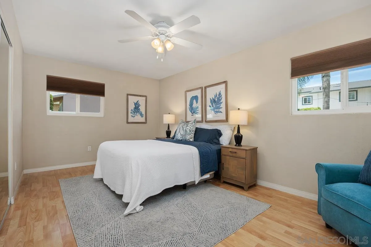 13961 Eastern Street Poway, CA 92064 - Photo 14 of 29 a spacious bedroom with a bed and a couch
