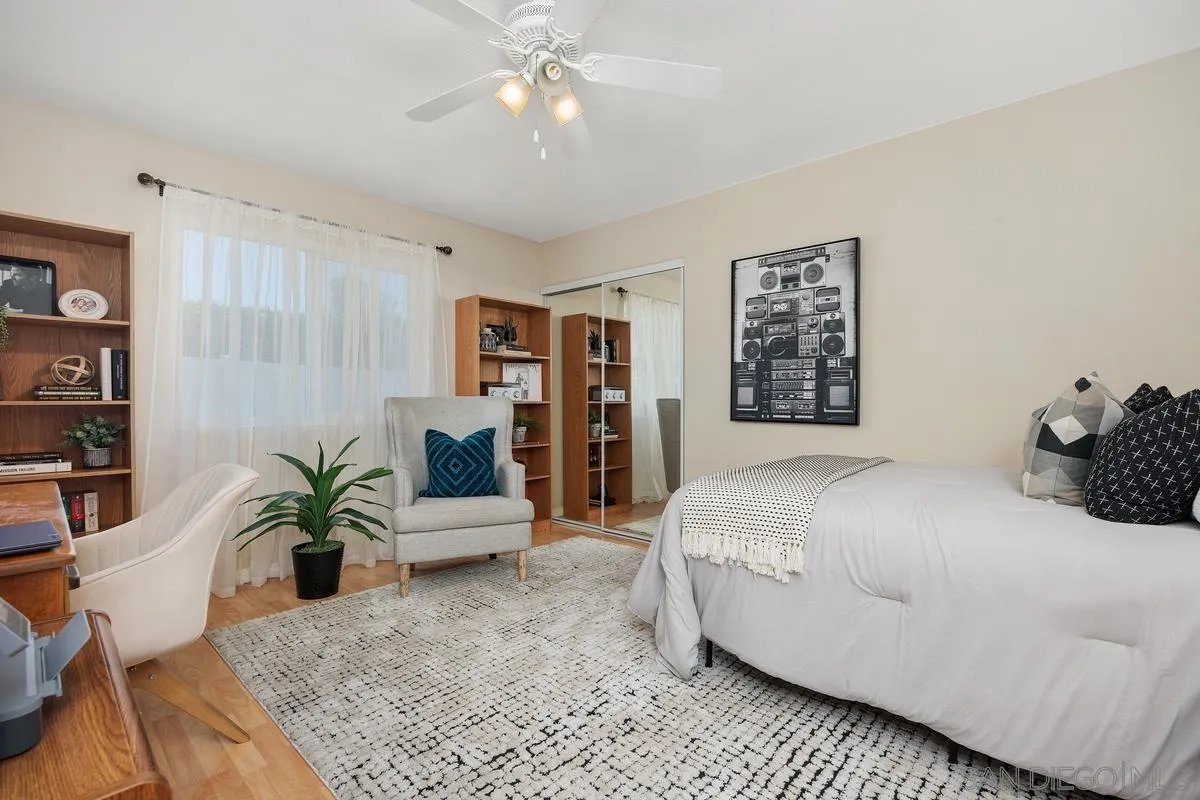 13961 Eastern Street Poway, CA 92064 - Photo 16 of 29 a bedroom with a large bed and a couch