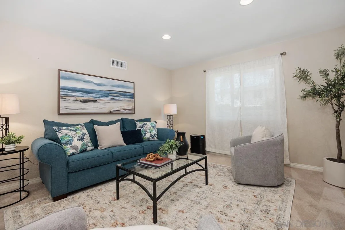 13961 Eastern Street Poway, CA 92064 - Photo 5 of 29 a living room with furniture and a potted plant