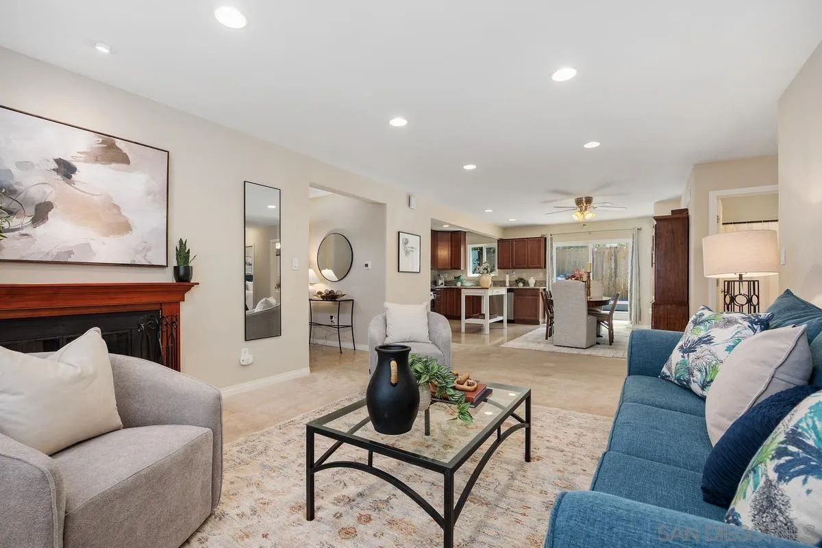 13961 Eastern Street Poway, CA 92064 - Photo 6 of 29 a living room with furniture kitchen view and a table