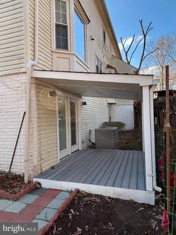 a view of backyard with a wooden deck