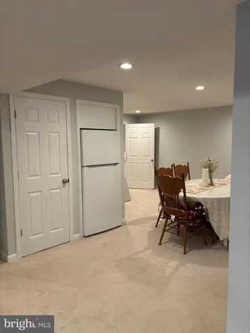 a view of a livingroom with furniture and a window