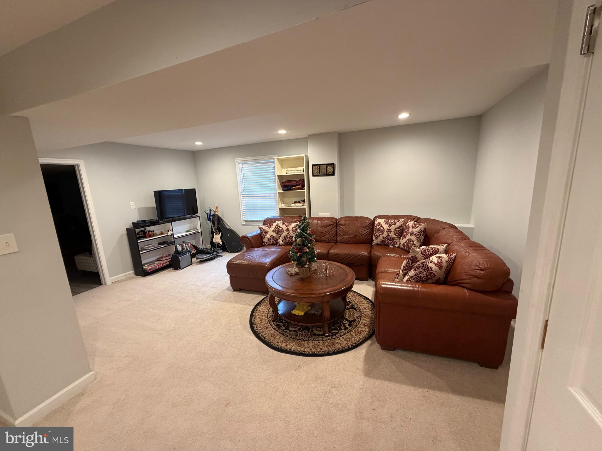 44140 Bristow Circle Ashburn, VA 20147 - Photo 5 of 14 a living room with furniture and a flat screen tv