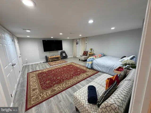 a living room with furniture and a rug