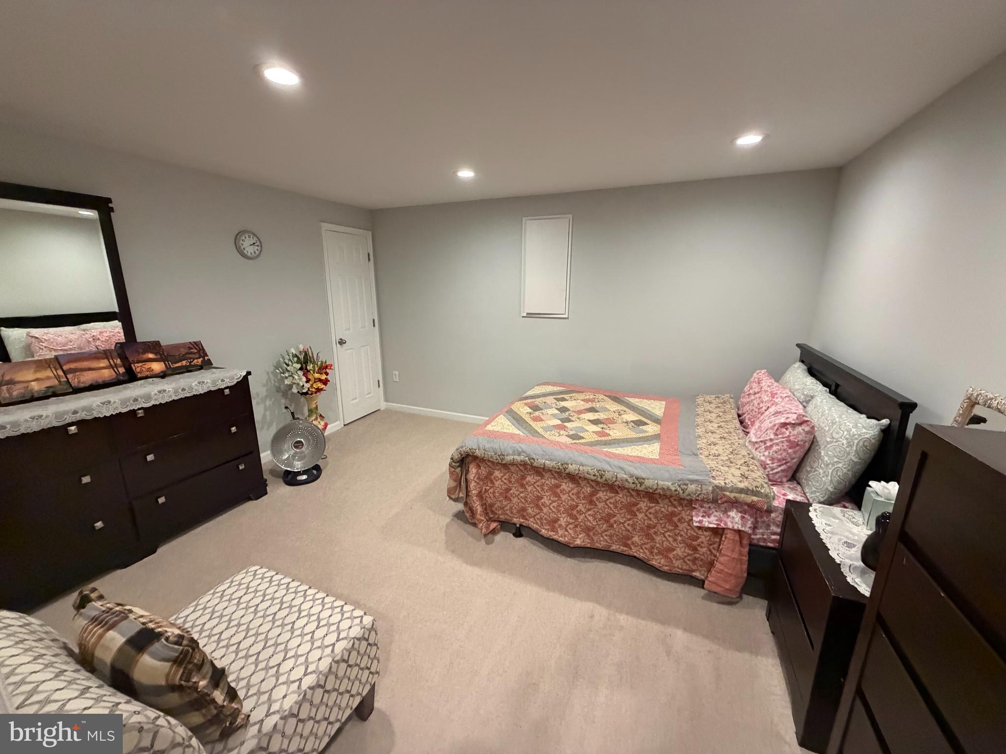 44140 Bristow Circle Ashburn, VA 20147 - Photo 10 of 14 a bedroom with a bed and a mirror on dresser