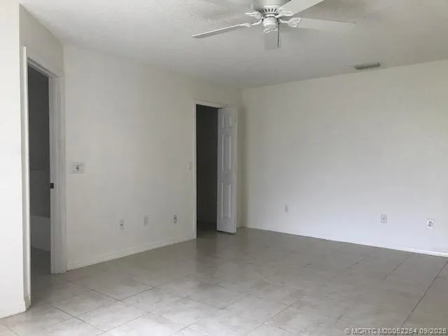 a view of an empty room and a window