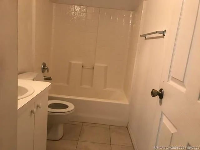 a bathroom with a sink toilet and mirror
