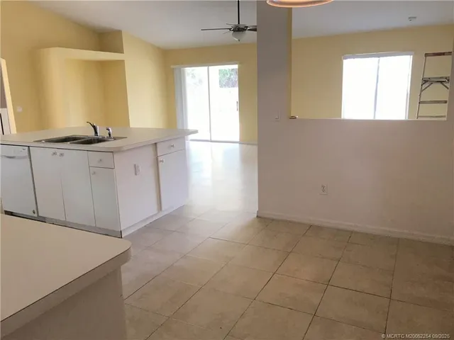 a kitchen with cabinets and stainless steel appliances