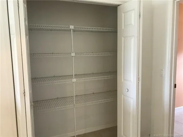 a view of a kitchen cabinets and windows