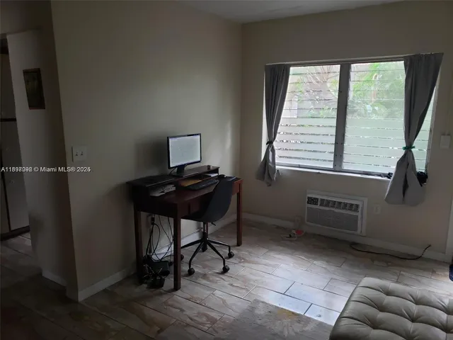 a room with furniture and a window