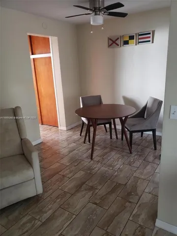 a view of a livingroom with furniture and wooden floor