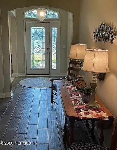 a room with furniture and wooden floor