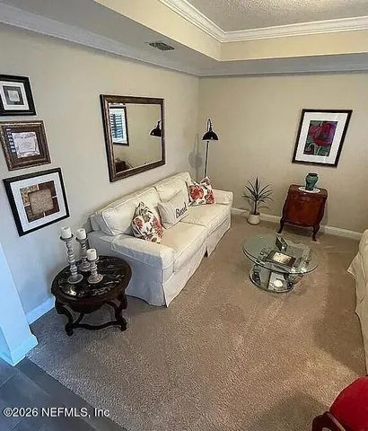 a living room with furniture and a couch