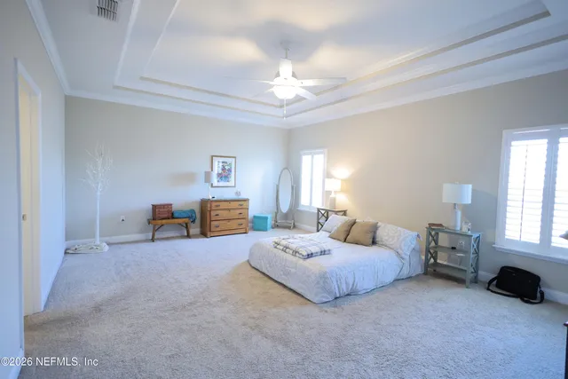 a bathroom with a sink mirror and a bathtub