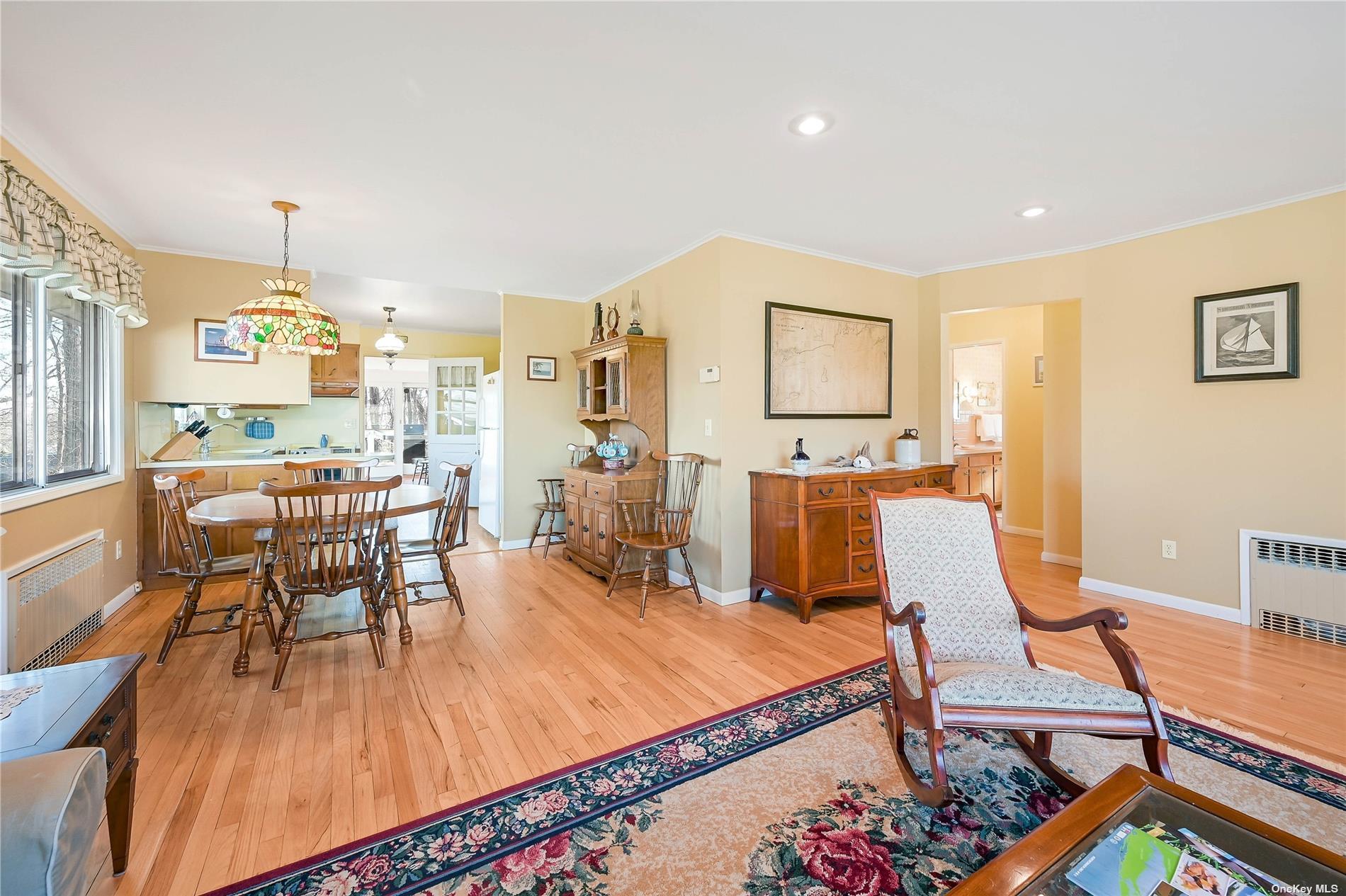 415 Southern Cross Road Cutchogue, NY 11935 - Photo 8 of 14 a living room with furniture and a wooden floor