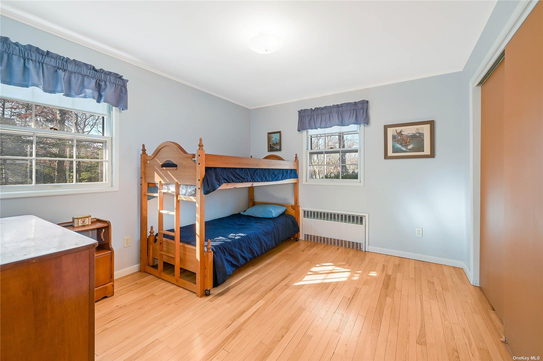 415 Southern Cross Road Cutchogue, NY 11935 - Photo 10 of 14 a bedroom with furniture and window