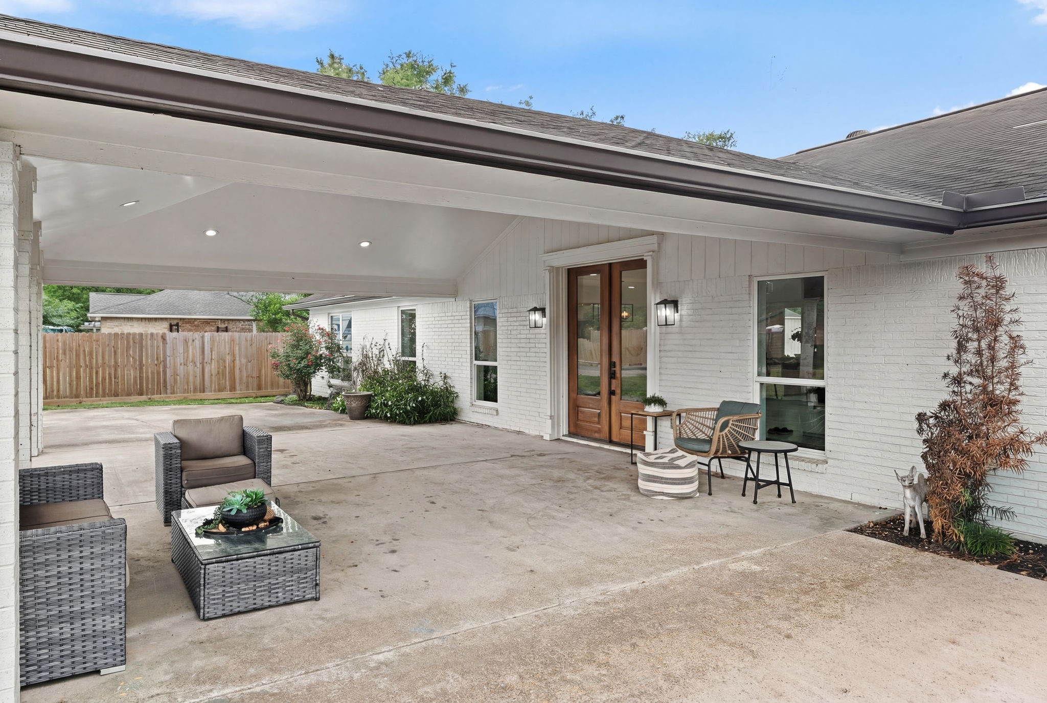 8800 Brae Acres Road Houston, TX 77074 - Photo 3 of 48 The covered front porch provides ample space for outdoor furniture and creates a usable outdoor space before you ever step foot inside.
