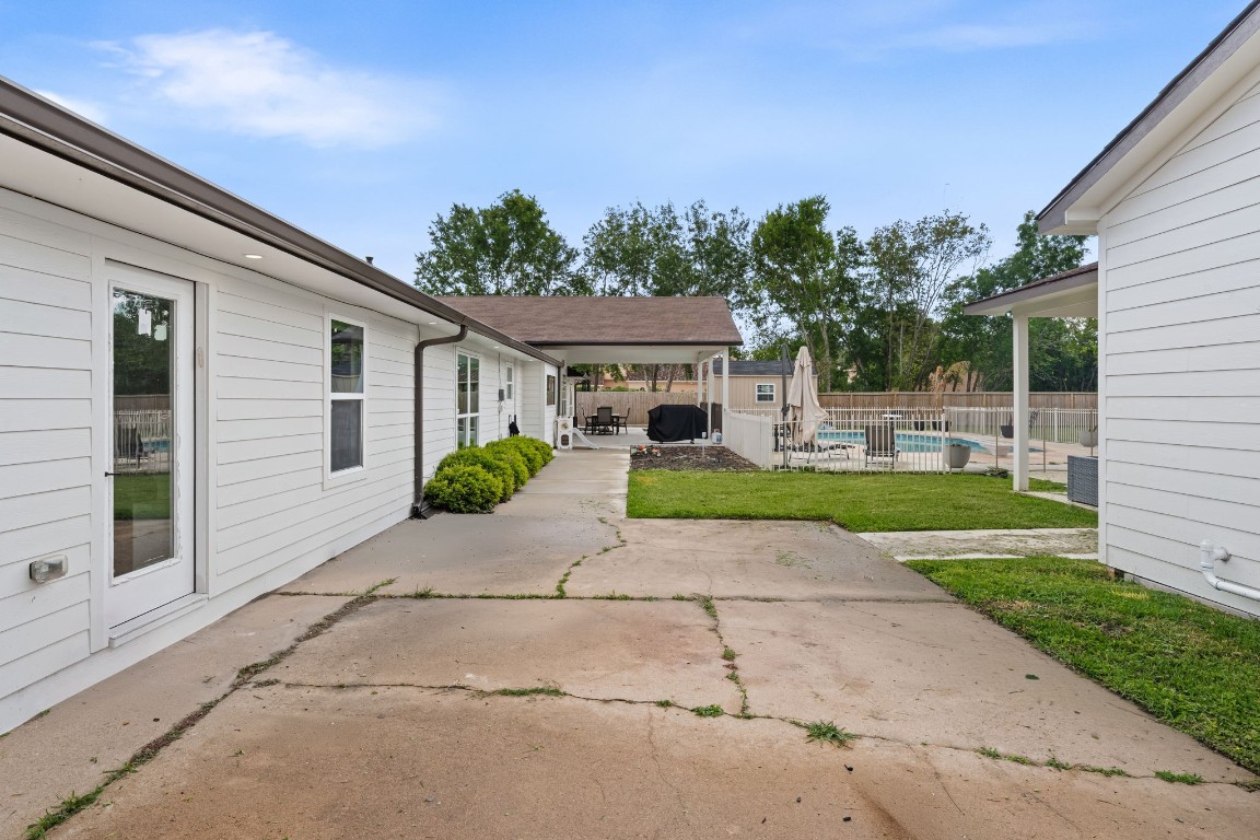 8800 Brae Acres Road Houston, TX 77074 - Photo 37 of 48 This large concrete pad adjacent to the guest quarters offers additional paved backyard space providing flexibility and possibility in this sprawling outdoor retreat.