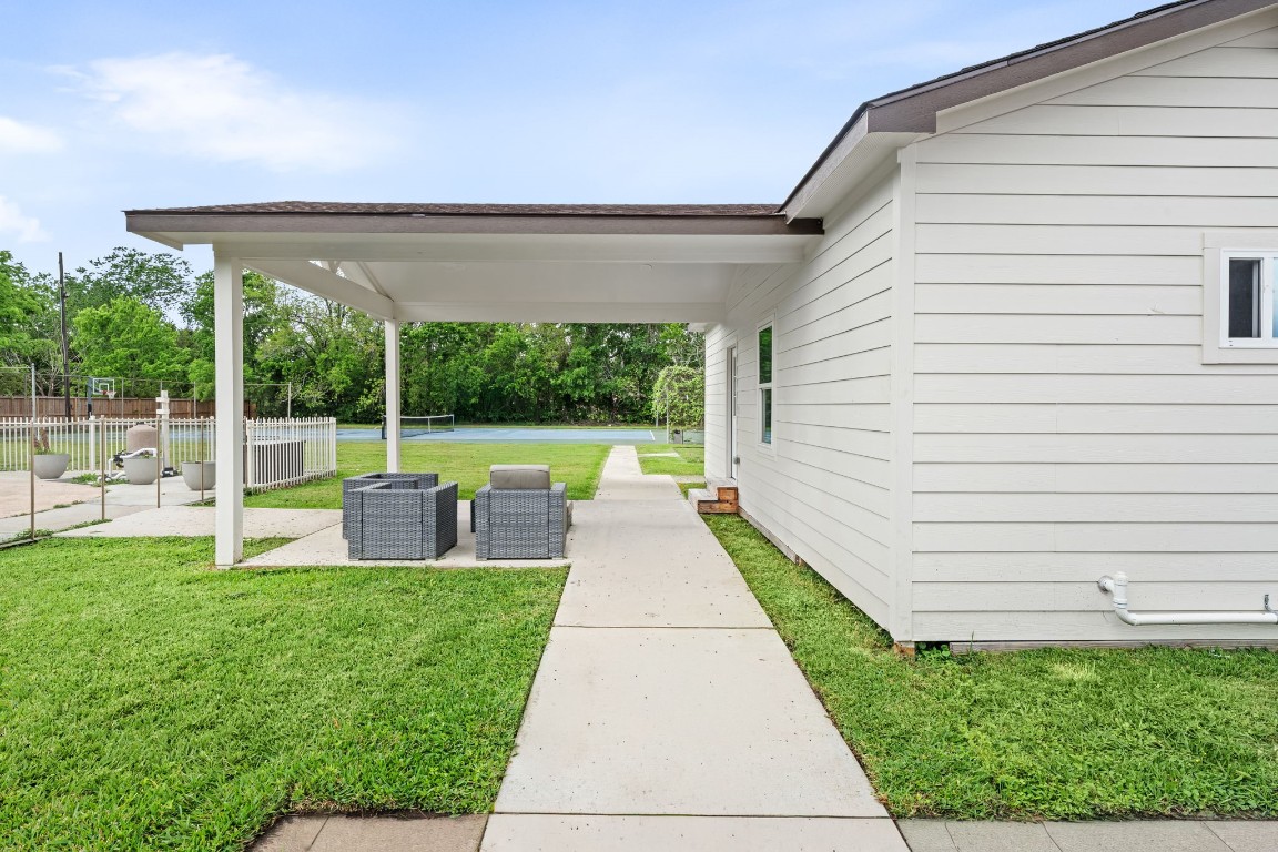 8800 Brae Acres Road Houston, TX 77074 - Photo 39 of 48 A second covered outdoor structure sits adjacent to the guest quarters — a flat-roof pavilion on white posts with its own footprint entirely separate from the main covered patio offered another covered retreat.