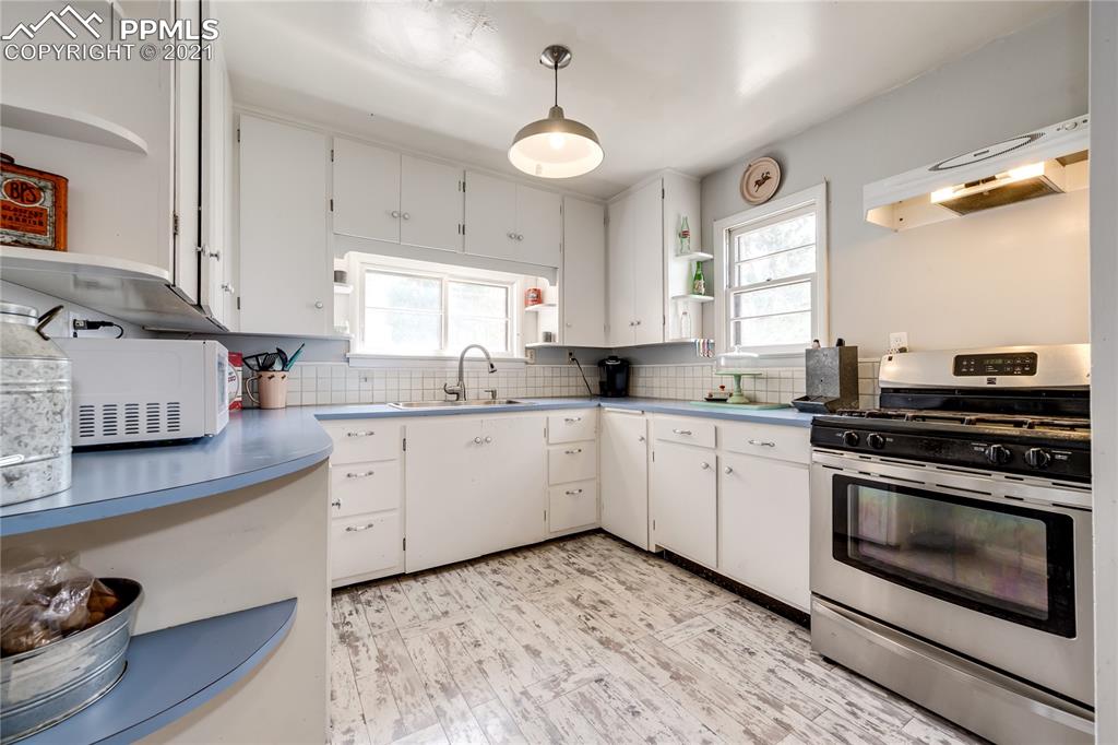 38810 Fossinger Road Rush, CO 80833 - Photo 12 of 35 a kitchen with a stove oven and sink