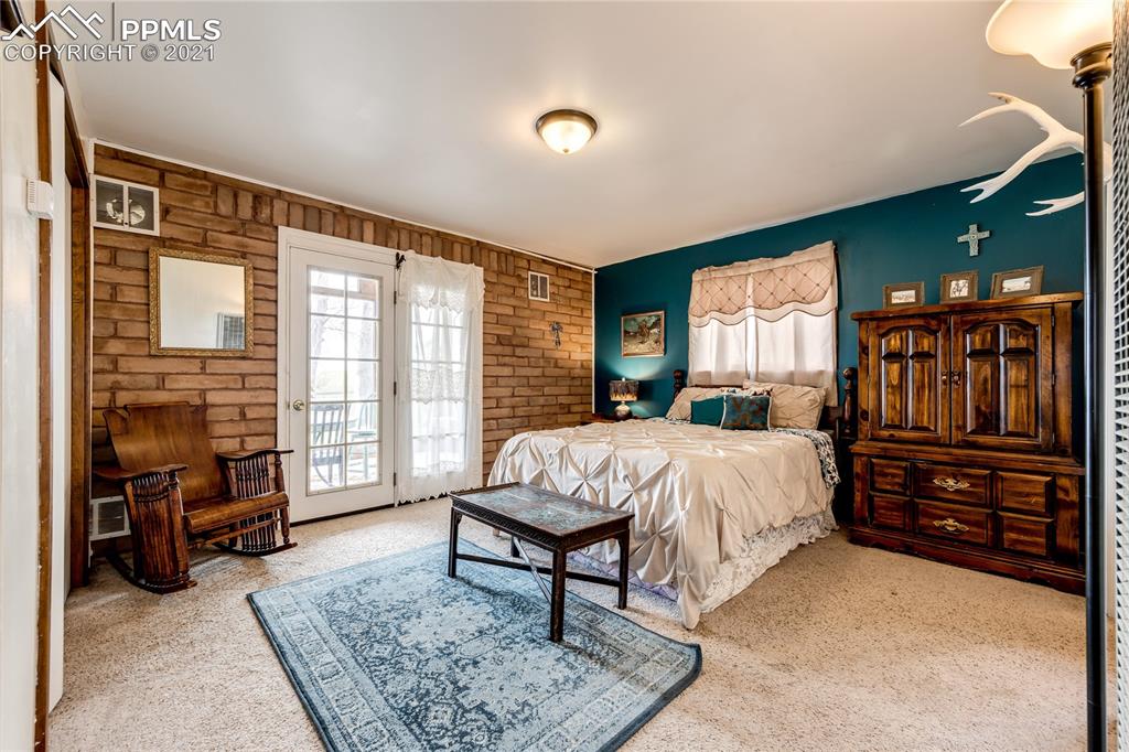 38810 Fossinger Road Rush, CO 80833 - Photo 16 of 35 a bed sitting in a spacious bedroom next to a window