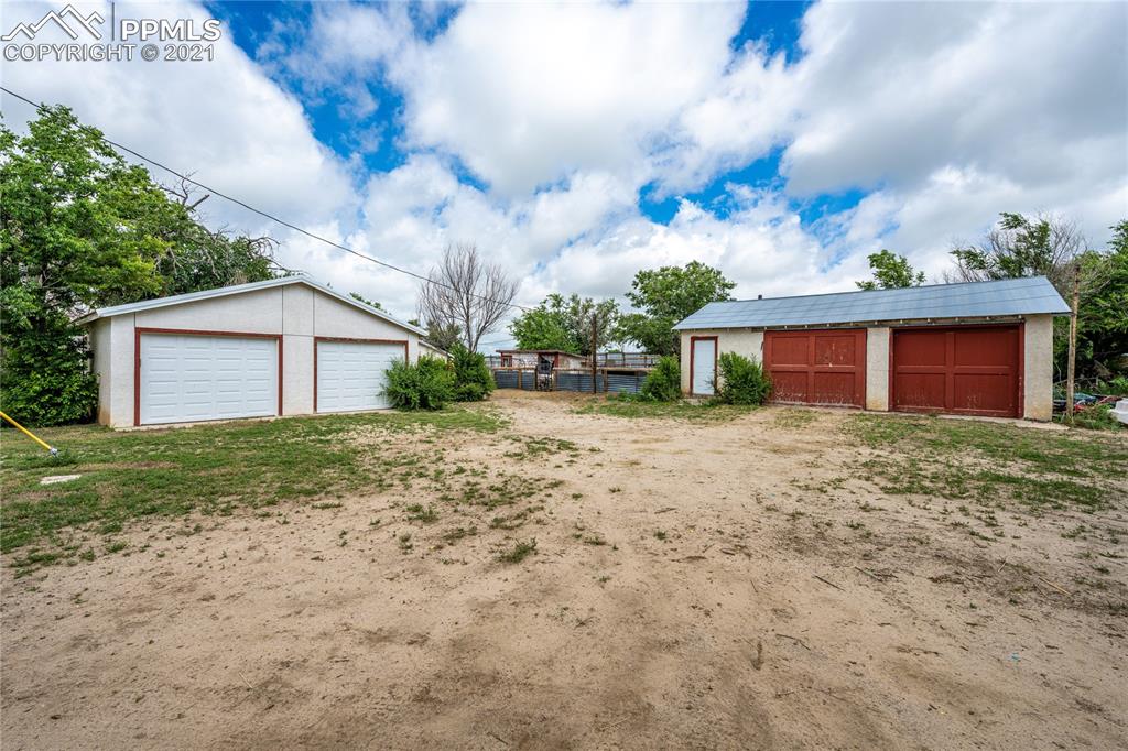 38810 Fossinger Road Rush, CO 80833 - Photo 3 of 35 a front view of a house with garden