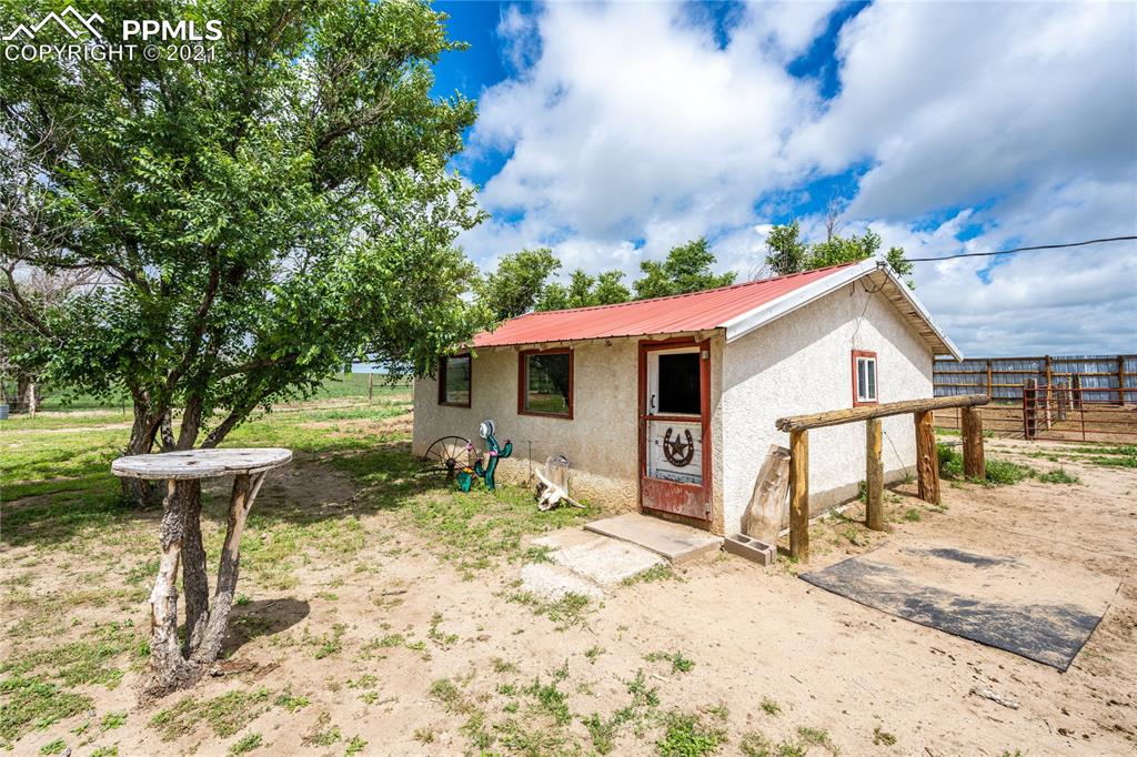 38810 Fossinger Road Rush, CO 80833 - Photo 25 of 35 a front view of a house with a yard covered in snow