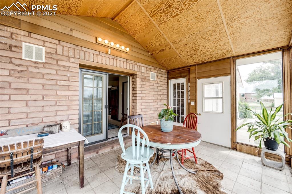 38810 Fossinger Road Rush, CO 80833 - Photo 4 of 35 a patio with table and chairs and potted plants