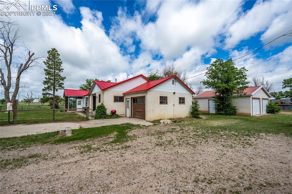 38810 Fossinger Road Rush, CO 80833 - Photo 5 of 35 a front view of house with yard and green space