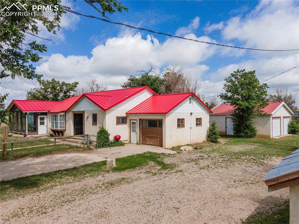 38810 Fossinger Road Rush, CO 80833 - Photo 6 of 35 a view of a house with a yard
