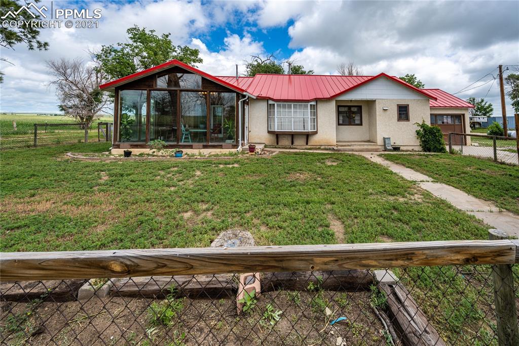 38810 Fossinger Road Rush, CO 80833 - Photo 7 of 35 a view of a house with garden