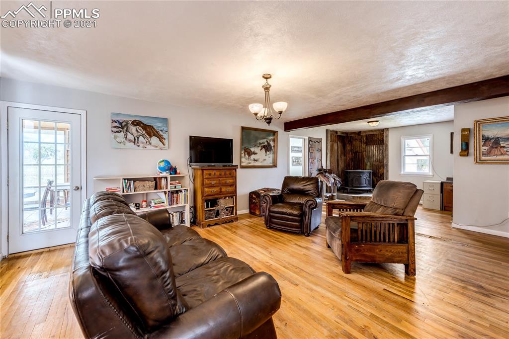 38810 Fossinger Road Rush, CO 80833 - Photo 8 of 35 a living room with furniture and a flat screen tv