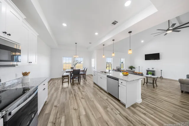 a kitchen with a table and chairs in it