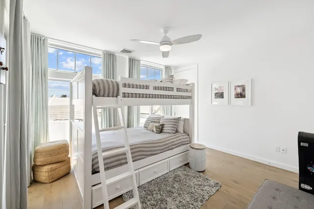 a bedroom with furniture and a window