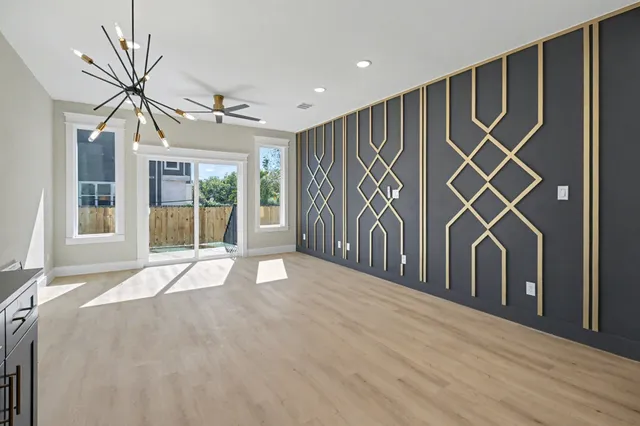 a view of an entryway with wooden floor