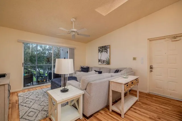 a view of a livingroom with furniture and a table