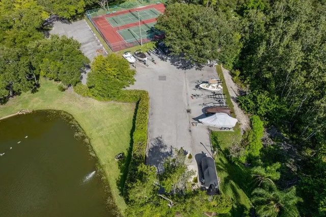 an aerial view of a house with a yard
