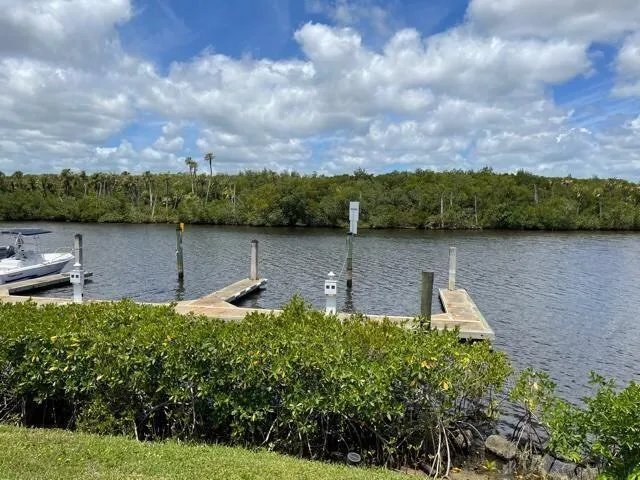 a view of a lake with a house in the background