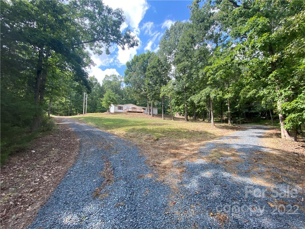 7109 Rushing Road Peachland, NC 28133 - Photo 3 of 40 a view of outdoor space with trees all around